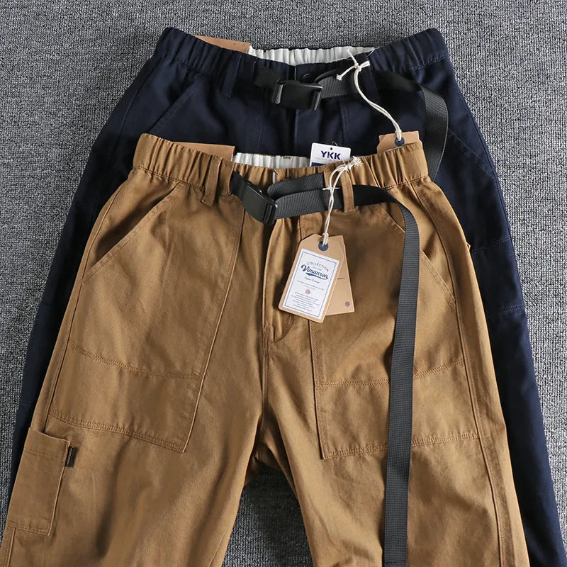 Men's khaki cotton trousers with belt buckle detail on mid waistband