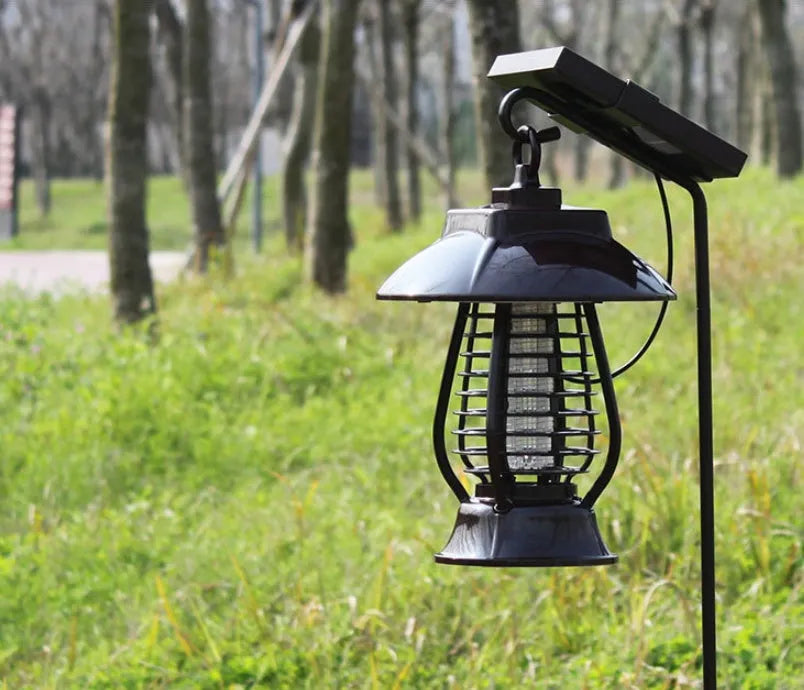 Black solar-powered mosquito lamp with solar panel and white LED light for outdoor insect control