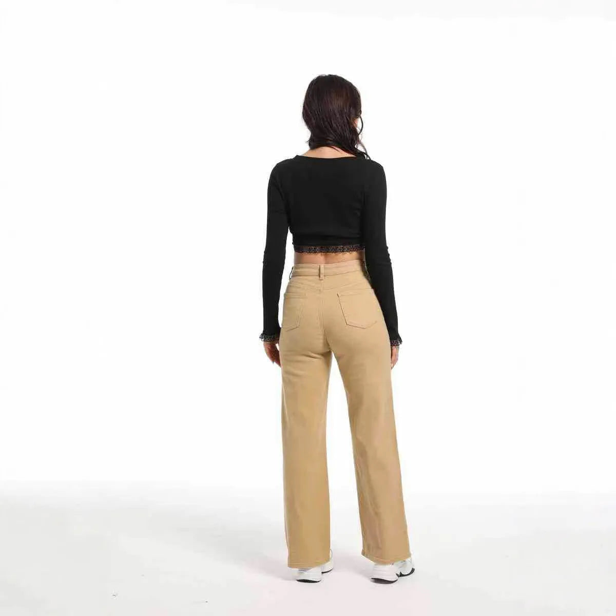 Women's high-waisted straight leg wide jeans in apricot colour on a hanger.
