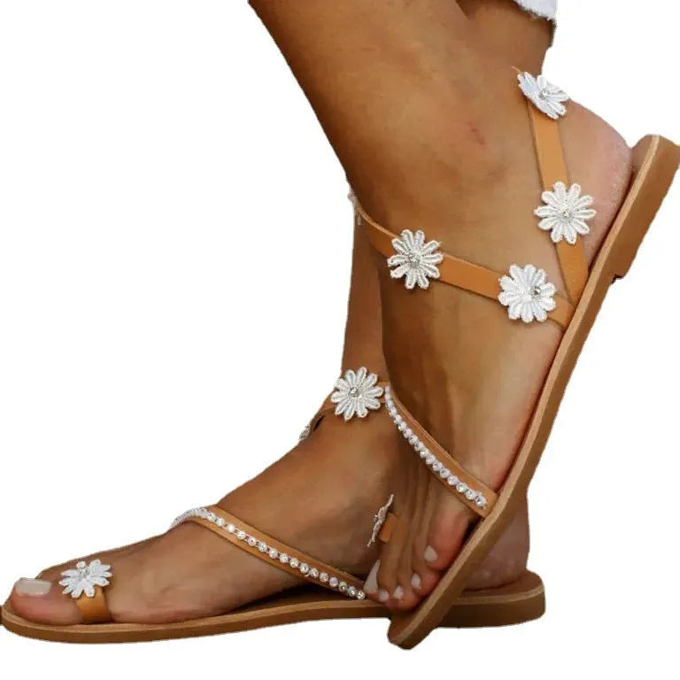 Brown women's Roman sandals with floral pattern and flat rubber sole