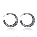 Vintage engraved C-shaped alloy drop earrings in bronze tone on a white background.