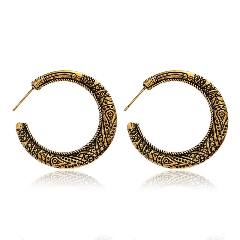 Vintage engraved C-shaped alloy drop earrings in bronze tone on a white background.