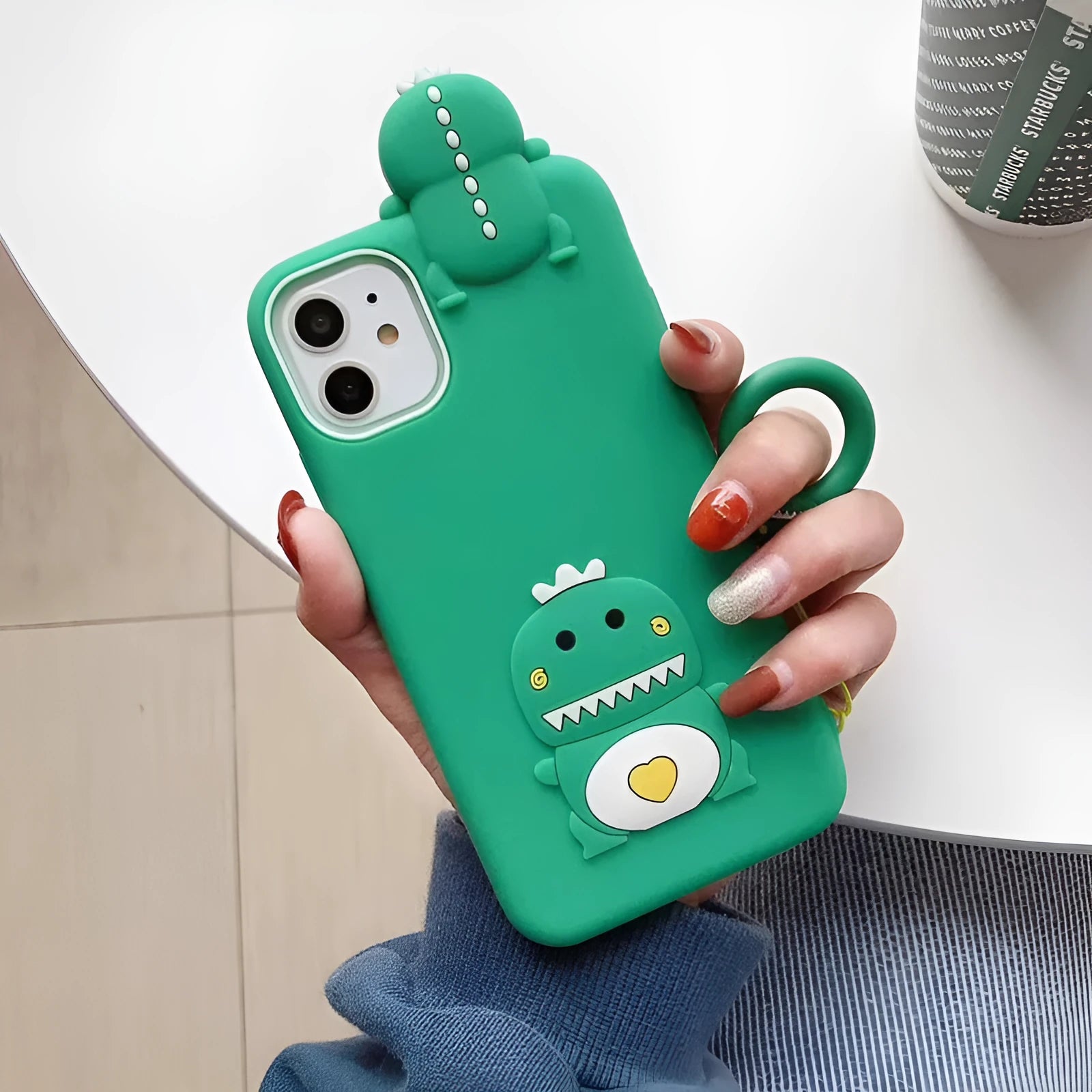 Green silicone iPhone case with cartoon animal design showing back cover protection