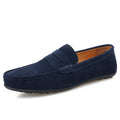 Men's solid colour suede loafers with a round toe and flat rubber sole on a neutral background.