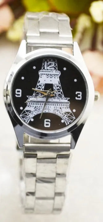 Eiffel Tower analogue wrist watch with stainless steel case, shown in men's and women's styles.
