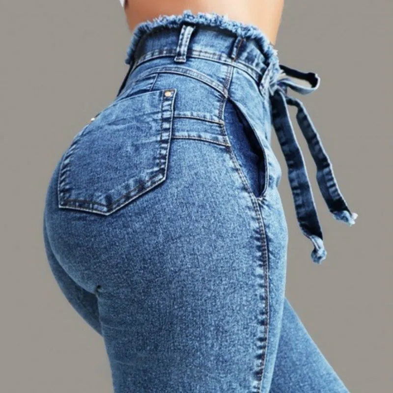 Fringed jeans in stretch cowboy denim with distressed hem detailing in dark blue colour