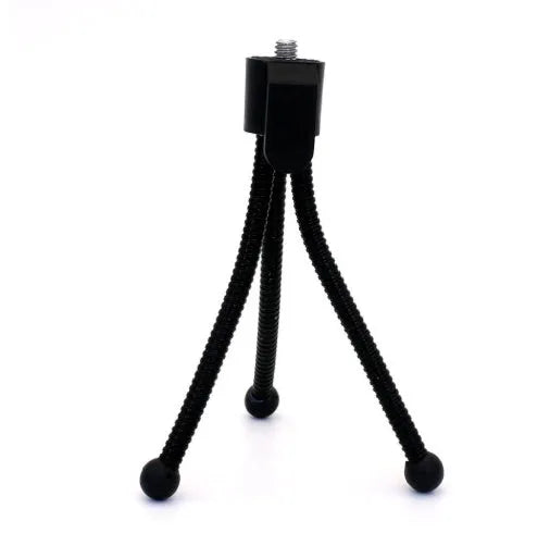 Small black iron mini tripod with ball head, shown extended next to a smartphone for scale.