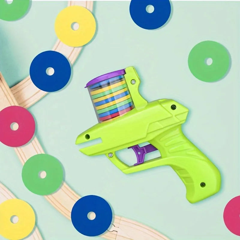 Interactive cat toy launcher with foam discs in green or purple colours