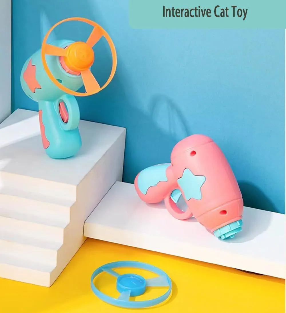 Blue interactive cat toy gun with spinning plastic frisbee for indoor cat play sessions