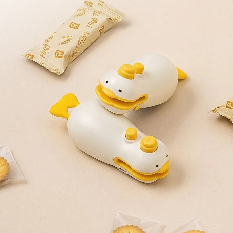 Small yellow rechargeable plastic bag sealing machine with animal jacquard pattern and USB charging cable