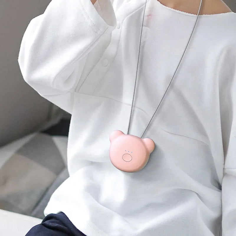 Mini USB air purifier necklace in blue, showing compact rectangular design on a lanyard.