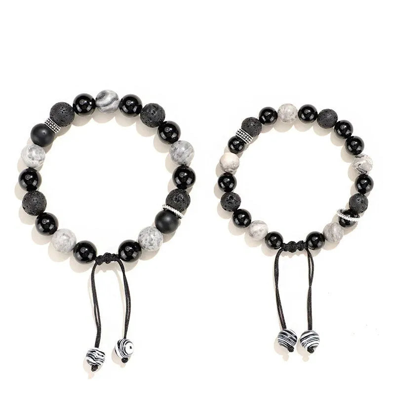 Black agate map stone diamond-shaped volcanic rock bracelet on a wrist, showing New Chinese style.