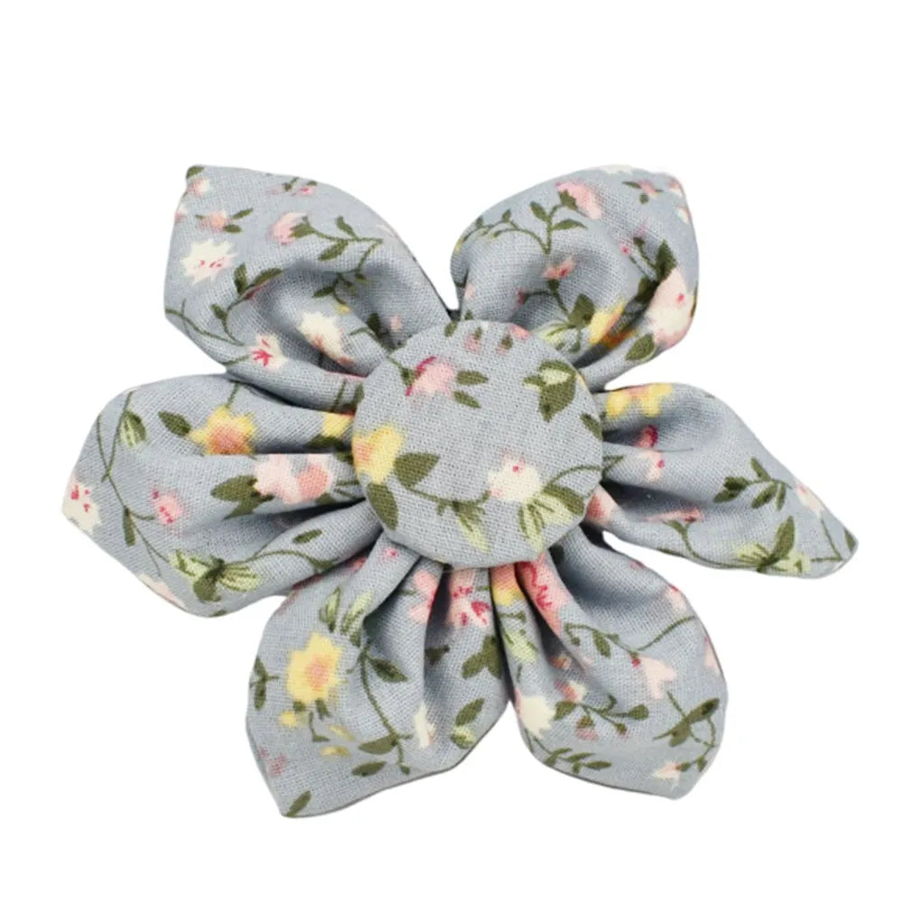 Blue floral pattern dog collar accessories set with adjustable collar, matching leash, bow, vest, and poop bag