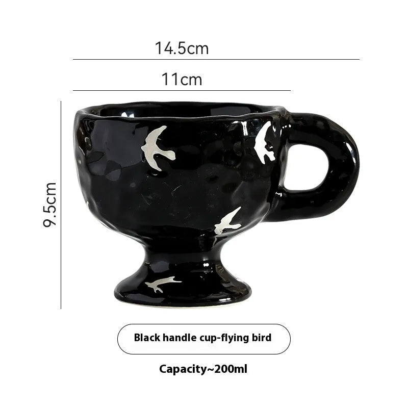 Hand-pinched irregular ceramic mug in a solid colour, shown from the side to display its unique shape.
