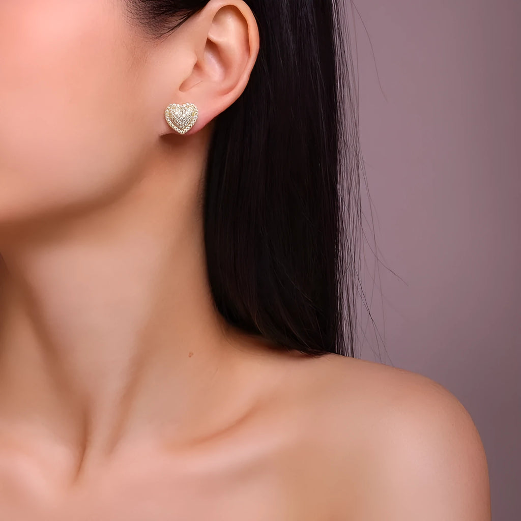Gold heart-shaped stud earrings with moissanite stones on S925 silver