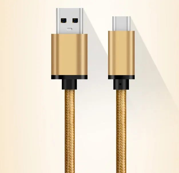 USB-C to USB-A charging and data cable with metal housing in gold colour
