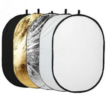 Collapsible five-in-one photography light reflector showing gold, silver, white, black, and translucent surfaces.