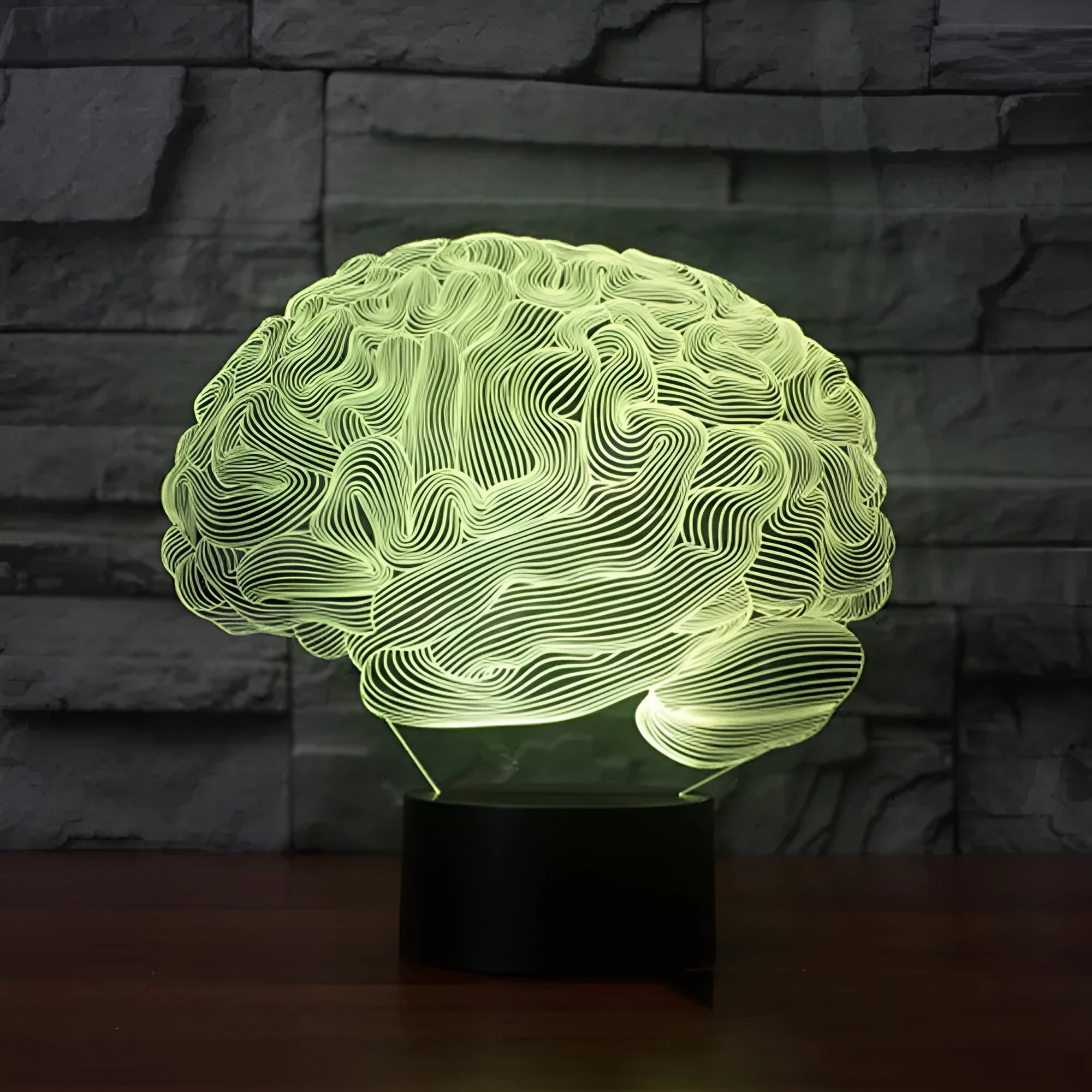 3D brain illusion LED lamp with acrylic plate glowing in multiple colours on a desk