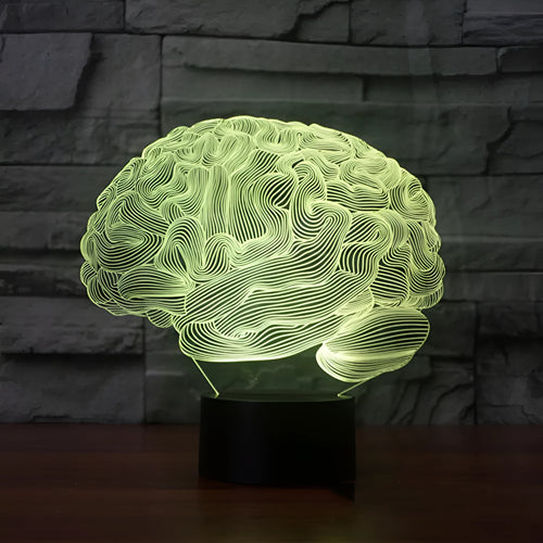 3D brain illusion LED lamp with acrylic plate glowing in multiple colours on a desk