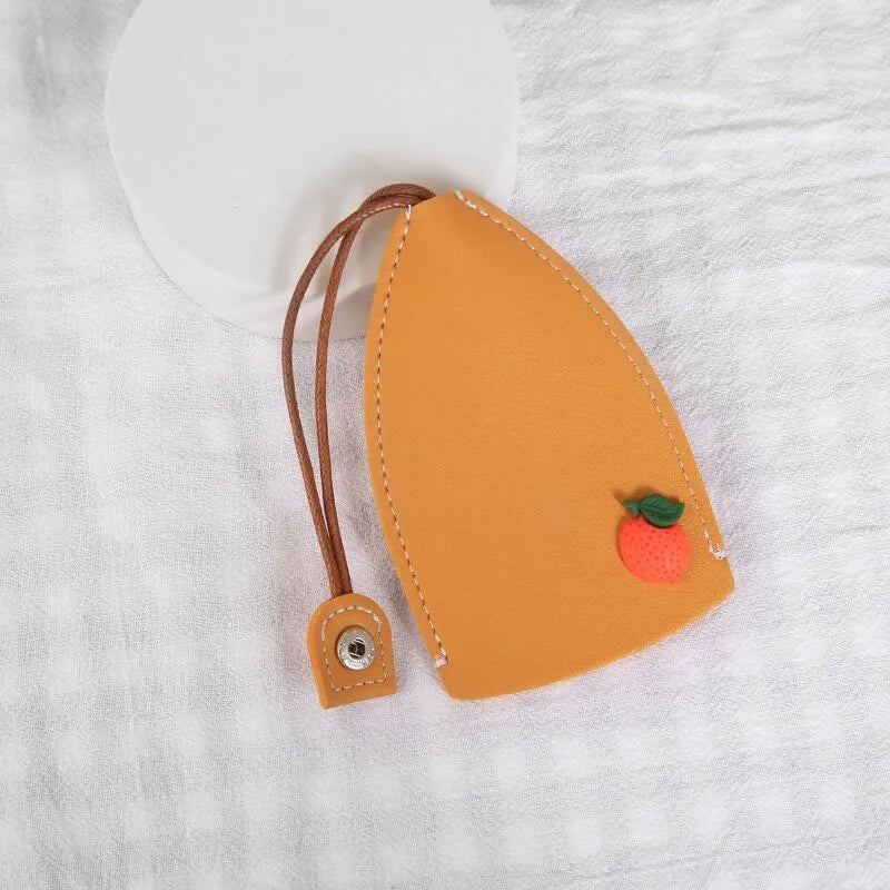 Colourful cartoon pull-out key case made from PU leather, showing the key extended from its protective sleeve.