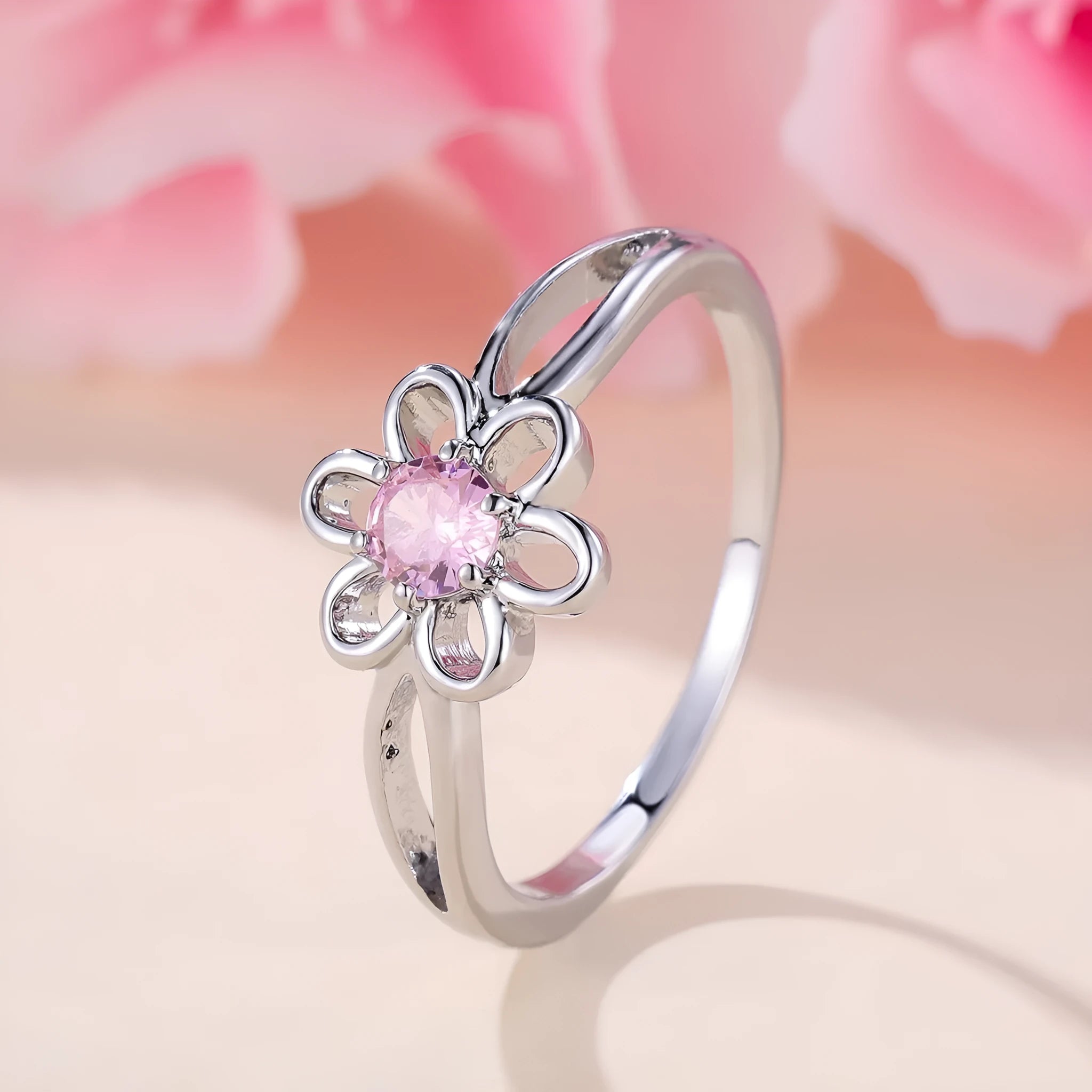 Women's fashion ring with hollowed flower pattern in electroplated copper, platinum pink diamond colour