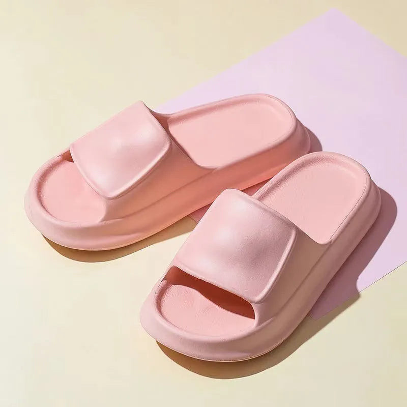 Unisex thickened EVA flip-flop slippers in black with a non-slip sole for bathroom use.