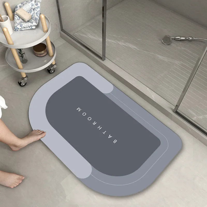 Blended fabric bathroom floor mat in blue colour, rectangular shape, on a tiled floor.