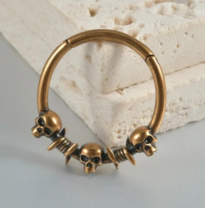 Copper punk earrings with vintage ghost head design in antique gold finish