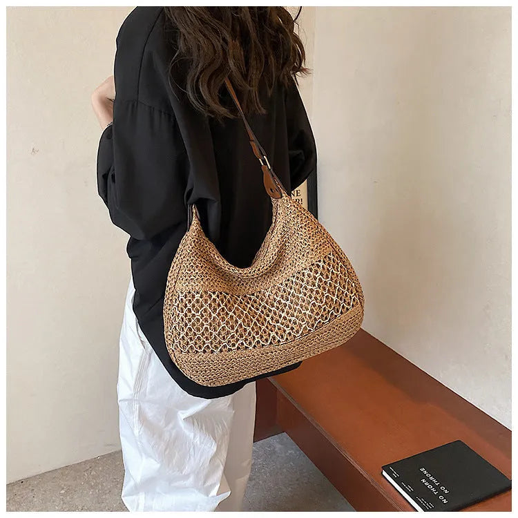 Women's straw cross body bag in horizontal square shape with sandwich pockets, shown in khaki colour