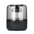 Black wireless Bluetooth speaker with LED lighting and touch controls showing four colours