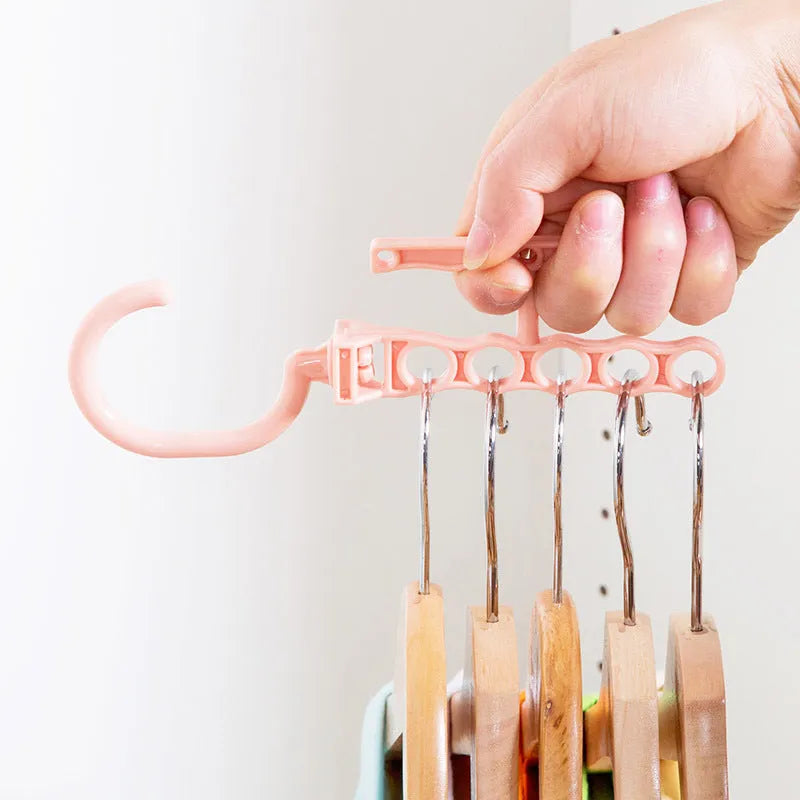 Revolving five-hole wardrobe hanger with handle in blue, green, or pink colour options