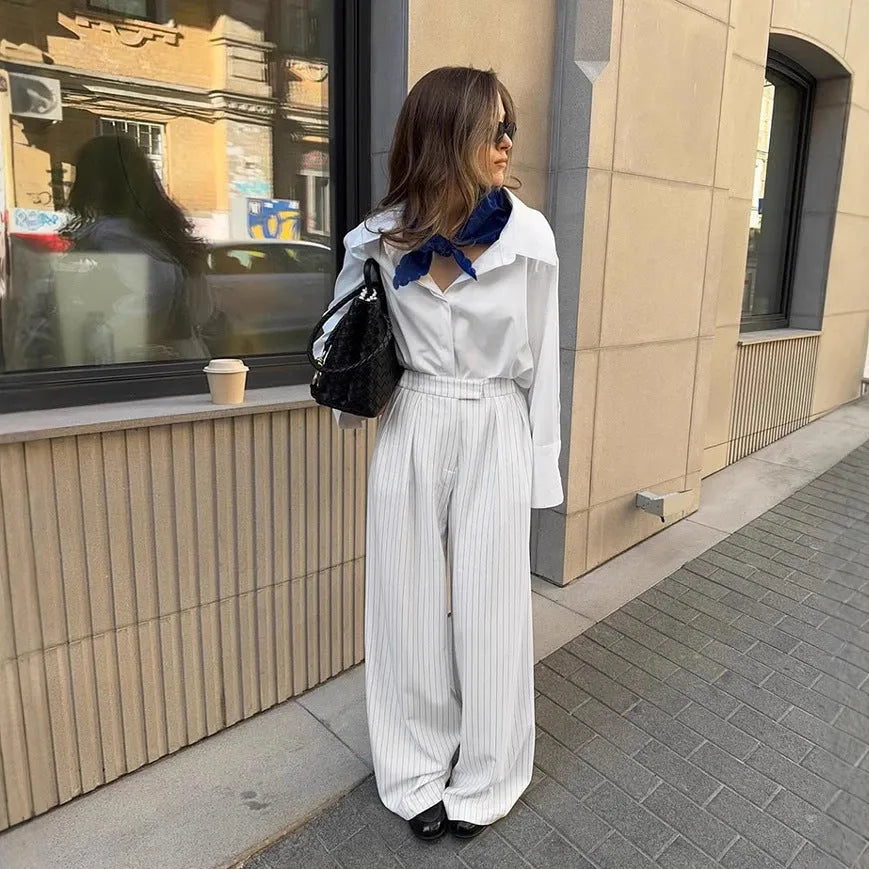 White striped women's wide-leg trousers with zip fastening and loose casual fit