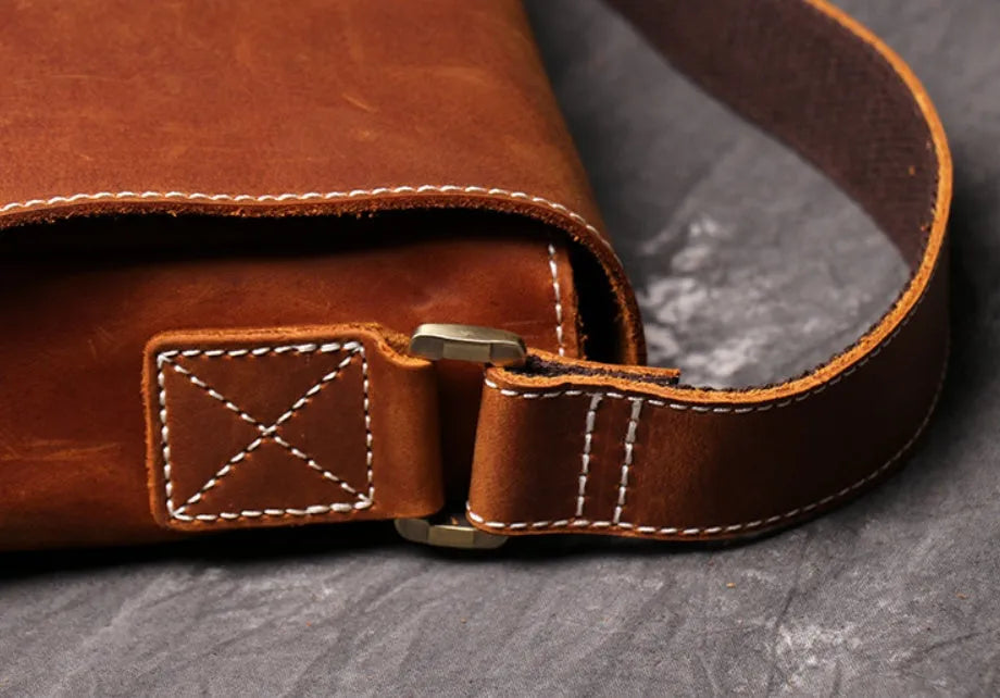 Men's vintage brown leather messenger bag with flap cover and adjustable shoulder strap