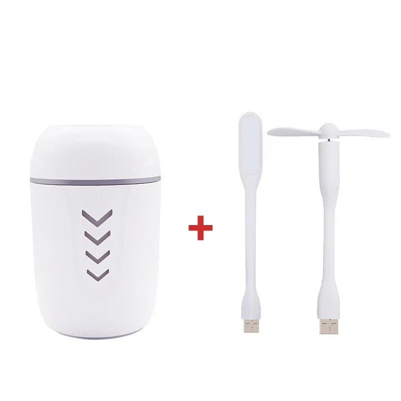 Blue X3 portable columnar humidifier with USB cable on a car dashboard.