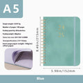 A5 size PU leather notebook with metal coil binding in a choice of colours including black, blue, brown, and pink.