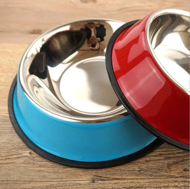Stainless steel pet bowl inside a colourful melamine bowl, showing non-slip rubber base, in orange colour.