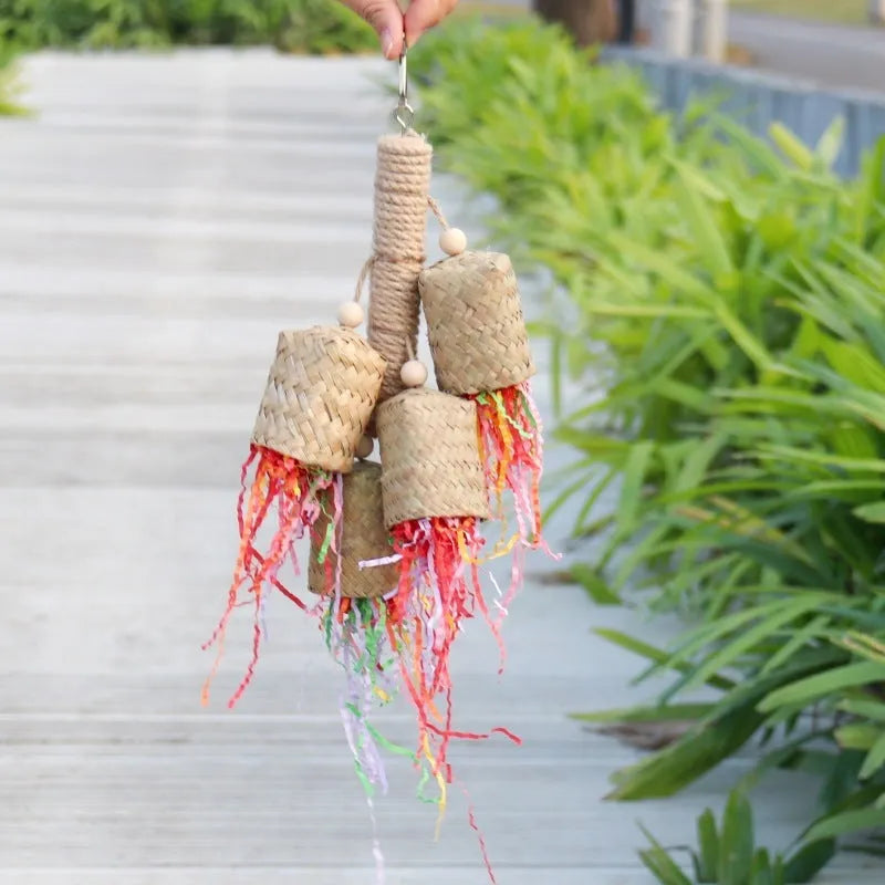 Colourful shredded paper parrot toy with wood and sisal construction hanging