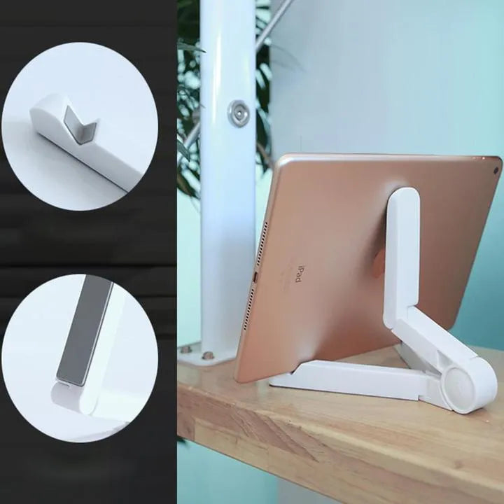 Black foldable tablet holder open on a desk supporting a tablet in landscape mode.