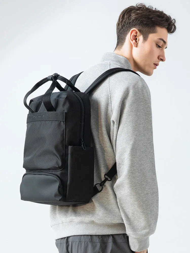 Elegant black Oxford cloth laptop backpack with 20-35 litre capacity and polyester lining