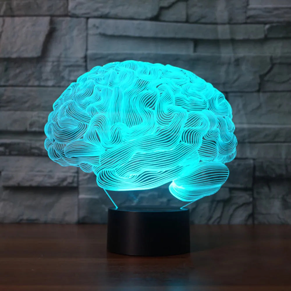 3D brain illusion LED lamp with acrylic plate glowing in multiple colours on a desk