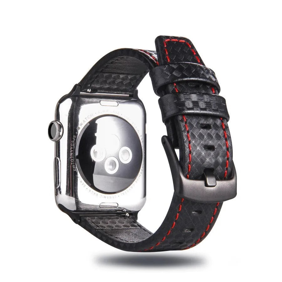 Apple Watch with black leather strap, carbon fibre details, and PC hard shell case with carbon fibre pattern.