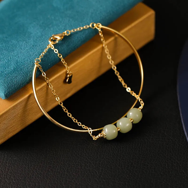 Hetian jade lucky beads bracelet for women with gold inlay, shown in single, double and three bead versions.