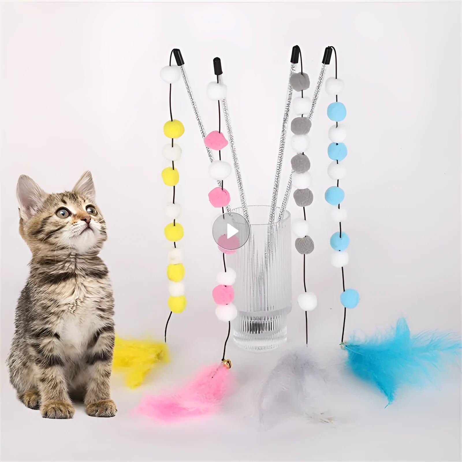 Colourful cat teaser toy stick with acrylic pompon, feathers, and a bell on a 31cm rod