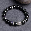 Unisex obsidian bracelet with lucky colour eye beads and silver cloud pattern detail, showing male 12mm and female 10mm sizes.