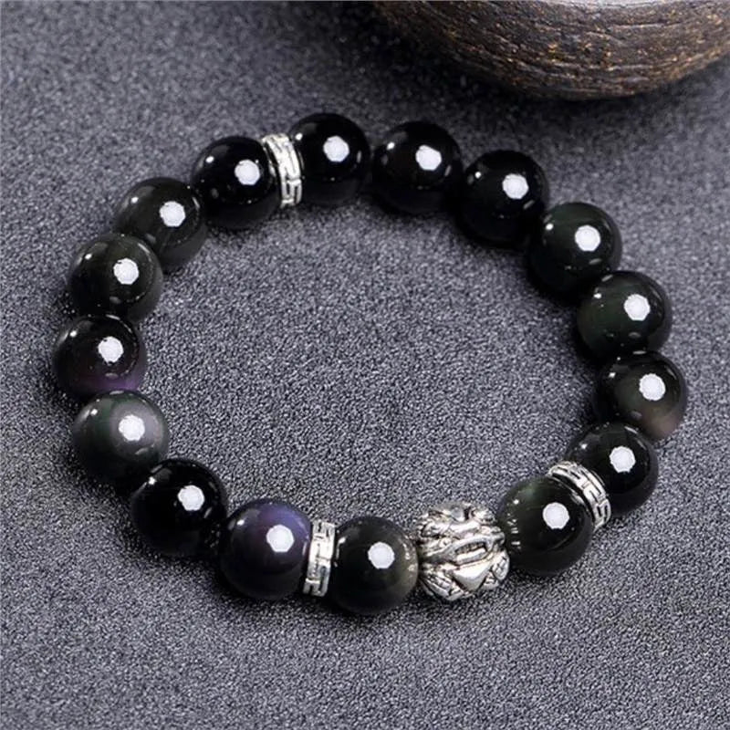 Unisex obsidian bracelet with lucky colour eye beads and silver cloud pattern detail, showing male 12mm and female 10mm sizes.