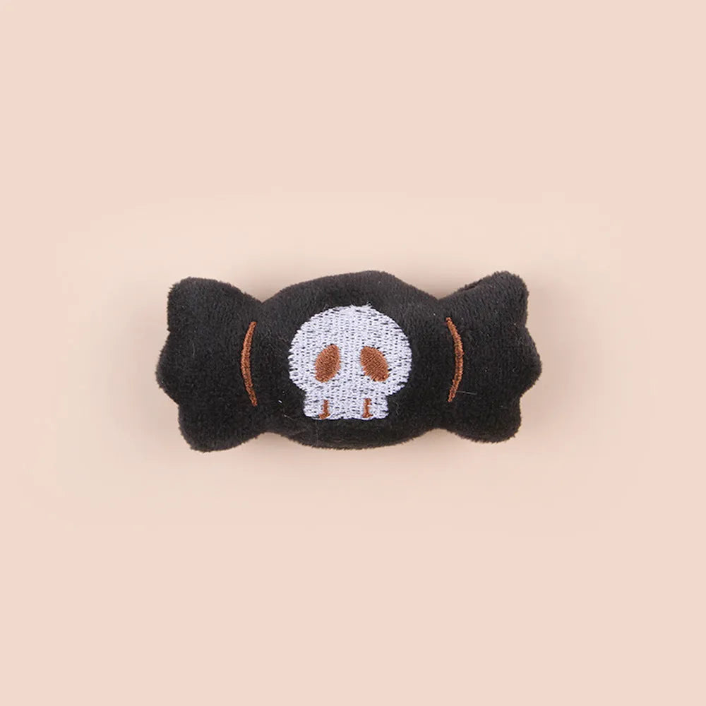 Small cat teaser wand toy with plush candy-themed attachment for interactive pet play