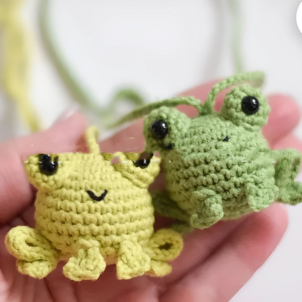 Handmade green plush frog woven car pendant hanging, showing soft texture and cartoon design.
