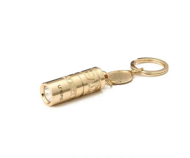 Gold zinc alloy waterproof mini LED flashlight attached to a keyring.