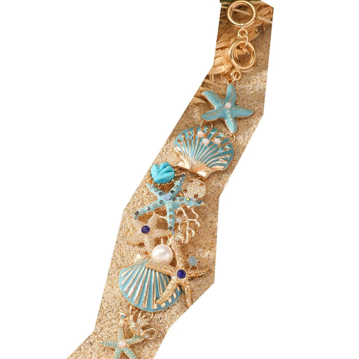 Women's alloy marine theme bracelet with boat anchor, shell, and starfish design in blue.