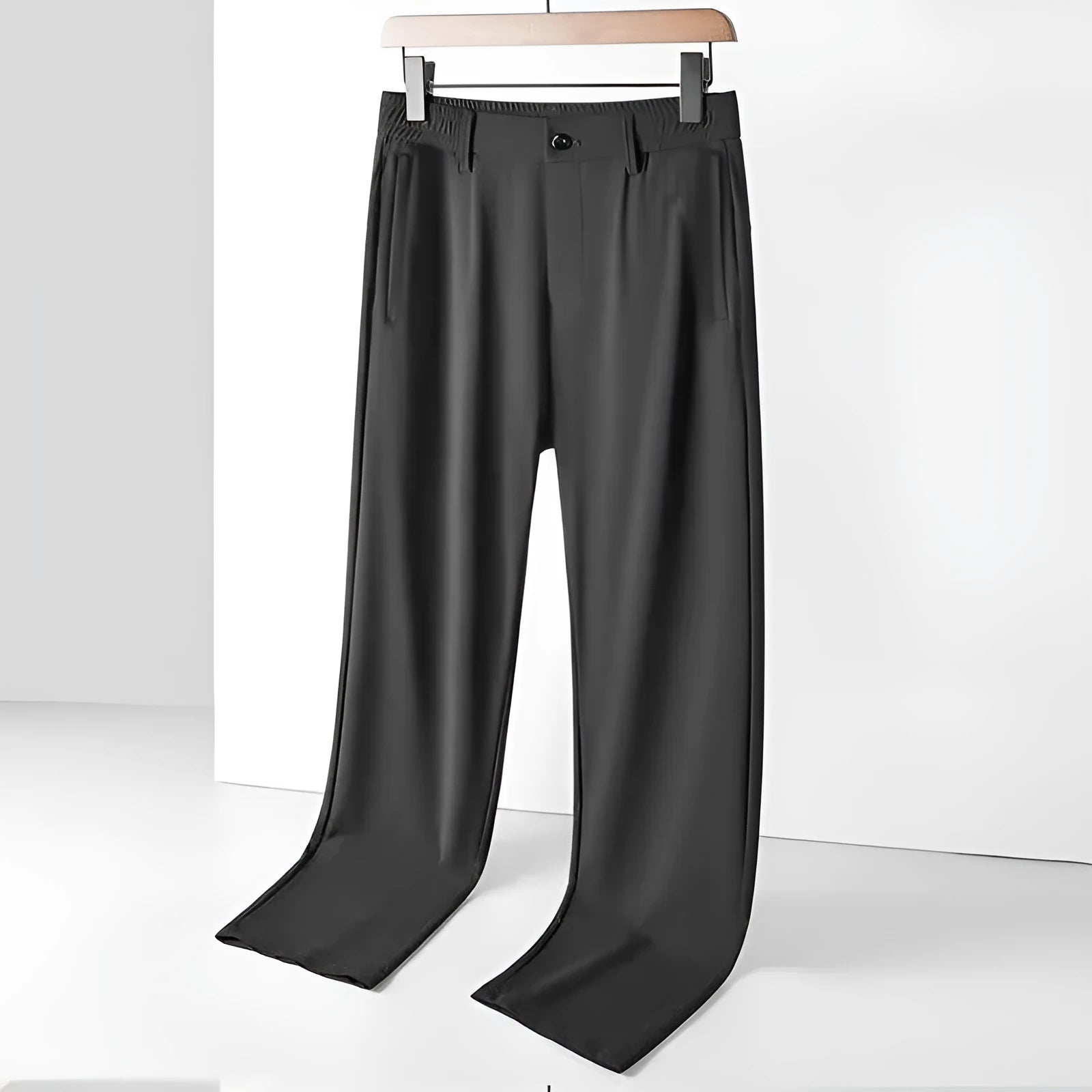 Men's loose-fit ice silk trousers in black, shown flat, highlighting the elastic waistband and straight leg.